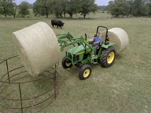 Many forage producers now use plastic net-wrap coverings to protect round bales from the effects of weather and to save time while baling. (DTN/The Progressive Farmer file photo)